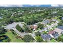 A bird's-eye view of the home in relation to a neighborhood golf course at 2402 Raven Croft Ct, Orlando, FL 32837