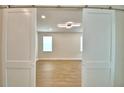 Bright and airy living room with wood-look floors and stylish ceiling light at 2673 Calistoga Ave, Kissimmee, FL 34741