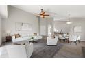 Bright living room with vaulted ceilings, modern decor and ample seating arrangement at 373 Shady Oak Loop, Davenport, FL 33896