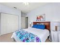 Cozy bedroom features a comfortable bed, closet and simple decor at 504 Terrace Ridge # 311, Davenport, FL 33896