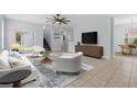Bright living room with tile floors, ceiling fan, and sliding glass doors to the outdoors at 6905 Beargrass Rd, Harmony, FL 34773