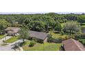 Desirable property featuring a spacious backyard adjacent to a serene pond at 8733 Catbriar Ln, Orlando, FL 32829