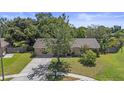 Quaint single-Gathering home with a mature shade tree and vibrant green lawn at 8733 Catbriar Ln, Orlando, FL 32829