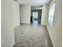 Hallway featuring gray tile floor leading to the main living area at 1370 Holodak Dr, Davenport, FL 33837
