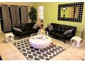 Chic living room featuring modern furniture, a stylish rug, and ample natural light at 2281 Royal Ridge Dr, Davenport, FL 33896