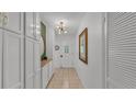 Bright entryway featuring tile floors, storage cabinets, and an eye-catching light fixture at 2727 Easton Ter, Lakeland, FL 33803