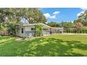 Beautiful single-story home with updated landscaping and a lush green lawn at 2727 Easton Ter, Lakeland, FL 33803