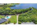 Breathtaking aerial view showcasing the property's proximity to the lake and surrounding greenery at 3158 Forest Breeze Way, St Cloud, FL 34771