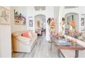 Bright living room featuring gray vinyl floors and open floor plan at 1014 Prey Ct, Kissimmee, FL 34746