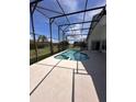 Inviting screened-in pool and spa area perfect for outdoor entertaining at 123 Moss Bluff Rd, Kissimmee, FL 34746