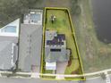 Aerial view outlining the property highlighting the spacious backyard, solar panels, and nearby community pool at 14081 Gullstrand Ave, Orlando, FL 32827