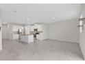 Spacious open-concept kitchen featuring an island and stainless steel appliances at 2690 Pleasant Cypress Cir, Kissimmee, FL 34741