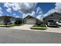 This lovely home boasts a manicured lawn, a pristine driveway, and an inviting exterior, perfect for families at 2727 Harmonia Hammock Rd, Harmony, FL 34773