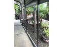 View of the side yard, featuring a defined property number and curated landscaping at 2082 Starboard Dr, Geneva, FL 32732