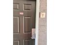 Apartment front door features a no smoking sticker and keyless lock at 3100 Parkway Blvd # 521, Kissimmee, FL 34747