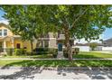 Charming two-story home with manicured lawn and sidewalk, offering a welcoming curb appeal at 3221 Bayflower Ave, Harmony, FL 34773