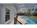 This covered pool features clear water, a dolphin design, and an abundance of lounging room at 408 Bloomingdale Dr, Davenport, FL 33897