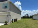 A spacious backyard showcasing the lawn, privacy and peaceful surroundings at 464 Talisi Loop, St Cloud, FL 34771