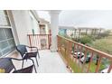 A cozy balcony with seating and view of the complex, great spot to relax outdoors at 4862 Cayview Ave # 40409, Orlando, FL 32819