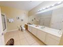 Bright bathroom with a large mirror, modern fixtures, and a walk-in shower at 4862 Cayview Ave # 40409, Orlando, FL 32819