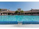 Beautiful swimming pool with lounge chairs for relaxation in a resort-style community at 4862 Cayview Ave # 40409, Orlando, FL 32819