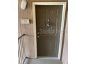 Apartment 308 front door showing door lock and knocker, well lit area at 6137 Metrowest Blvd # 308, Orlando, FL 32835