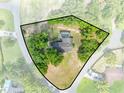 Aerial view showcasing the home, the in-ground pool, and its landscaped lot bordered by mature trees and greenery at 6441 Nightwind Cir, Orlando, FL 32818
