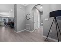Open hallway with tile flooring leading to the main living areas, with a neutral color scheme at 11051 Bostwick Aly, Winter Garden, FL 34787