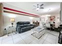 Cozy living room with a ceiling fan, stylish furniture, and open access to the dining area at 14234 Desert Haven St # 14234, Windermere, FL 34786