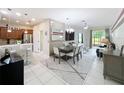 Bright and airy interior featuring a combined living and dining area with modern furnishings at 14234 Desert Haven St # 14234, Windermere, FL 34786