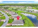 Aerial view of the home's location within a community, highlighted by nearby ponds and lush green spaces at 159 Olympus Way, Kissimmee, FL 34759