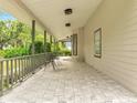 Comfortable covered porch with tiled flooring and outdoor seating at 2525 Ridgeway Dr, Kissimmee, FL 34746