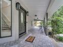 Covered front porch with welcome mat and outdoor seating at 2525 Ridgeway Dr, Kissimmee, FL 34746