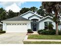 Inviting single-Gathering home with manicured lawn and a 2-car garage and simple landscaping at 2591 Oneida Loop, Kissimmee, FL 34747