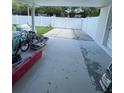 Spacious backyard with a sturdy white fence, offering privacy and room for outdoor activities at 400 Vermont Ave, St Cloud, FL 34769