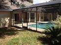 Enclosed pool area showing door access and the swimming pool at 4820 Wingrove Blvd, Orlando, FL 32819