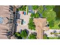 Overhead view of an upscale condo community surrounded by lush landscaping with a central fountain and parking at 502 Mirasol Cir # 103, Kissimmee, FL 34747