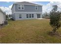 Spacious backyard offers a patio and plenty of room for outdoor activities and customization at 5793 Gingham Dr, Kissimmee, FL 34758