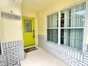 Inviting front entrance with a bright green door and a welcoming sign at 162 Seneca Point Trl, Kissimmee, FL 34746