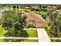 Charming single-Gathering home with lush front yard, a two-car garage, and inviting curb appeal at 1902 Tumblewater Blvd, Ocoee, FL 34761