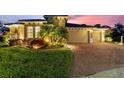 Beautiful home exterior with a well manicured lawn and lovely landscaping at 346 Treviso Dr, Kissimmee, FL 34759