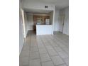 Open living space featuring tile floors with an open concept to the kitchen at 3502 Windy Walk Way # 2-208, Orlando, FL 32837
