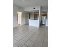 Open living space featuring tile floors with an open concept to the kitchen at 3502 Windy Walk Way # 2-208, Orlando, FL 32837