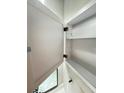 Bathroom cabinet featuring two shelves offering plenty of storage space at 5967 Village Cir # Ge, Orlando, FL 32822