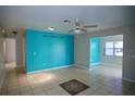 Open floorplan featuring tile flooring, painted walls, and ceiling fan at 926 Chula Ct, Lady Lake, FL 32159