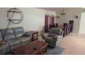 Spacious living room and dining area combination, perfect for gatherings, with ample seating and natural light at 117 Winchester Ln, Haines City, FL 33844