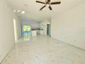 Open living space with recessed lighting, ceiling fan, and bright, airy feel thanks to large windows at 1236 N Virginia Ave, Lakeland, FL 33805