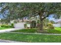 Traditional home boasting a beautiful, mature shade tree at 14287 E Weymouth Run, Orlando, FL 32828