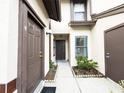 Welcoming front entry with two doors, enhanced by neat landscaping and a paved walkway at 3006 S Semoran Blvd # H-3, Orlando, FL 32822