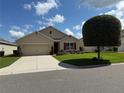 Beautiful single-Gathering home with a well-maintained lawn and attractive landscaping at 306 Briar Patch Loop, Davenport, FL 33896